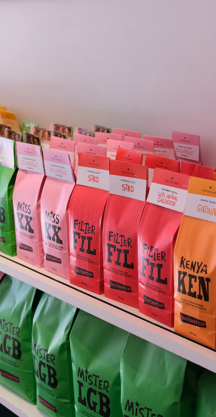 Shelves packed with colourful Caffenation coffee bags